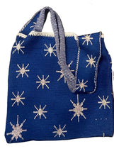 Load image into Gallery viewer, Three knit tote bags with glow-in-the-dark stars and text 'afrobeta' and 'KREL' on them, displayed on a floor.