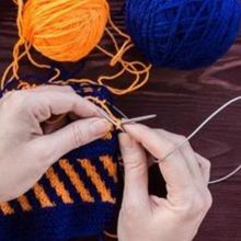 Load image into Gallery viewer, close up of hands knitting with yarn