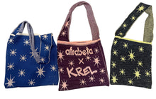 Load image into Gallery viewer, Three knit tote bags with glow-in-the-dark stars and text &#39;afrobeta&#39; and &#39;KREL&#39; on them
