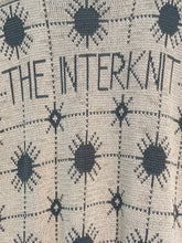 Load image into Gallery viewer, &#39;THE INTERNET&#39; on a textured fabric background with black abstract pom pom shapes.
