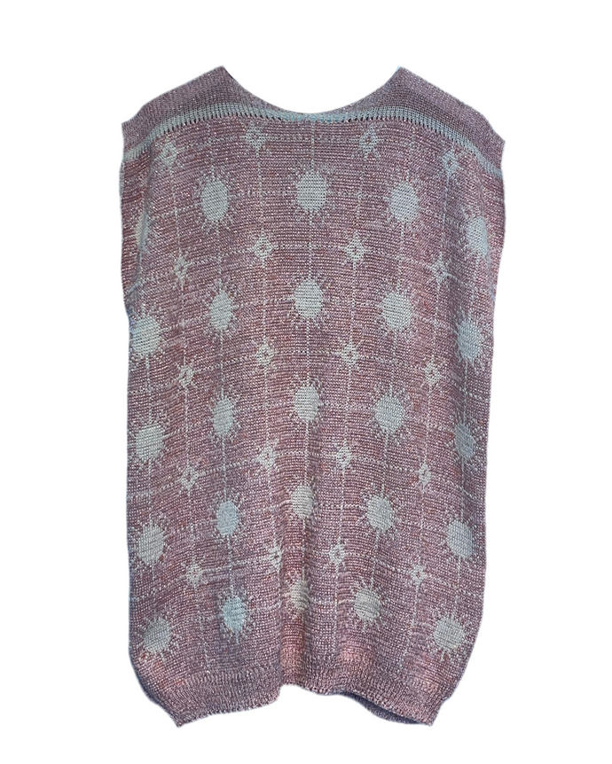 Knitted vest with star pattern on a hanger against a white background