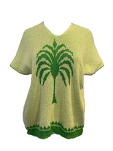 Load image into Gallery viewer, Green knitted sweater with a palm tree design on a mannequin against a white background
