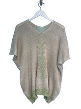 Load image into Gallery viewer, Knitted sweater on a hanger against a blue background
