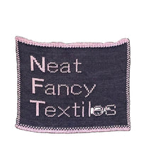 Load image into Gallery viewer, NFT Neat Fancy Textile navy with lavender text  fiber art 
