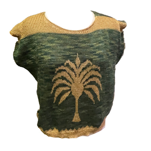 A green and beige reversible palm tree fairisle knit top displayed on a mannequin.