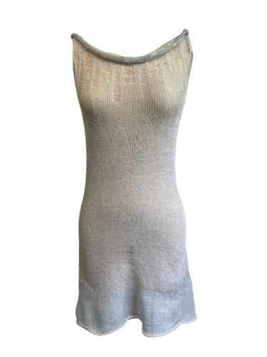 Mannequin wearing a textured white sleeveless dress 