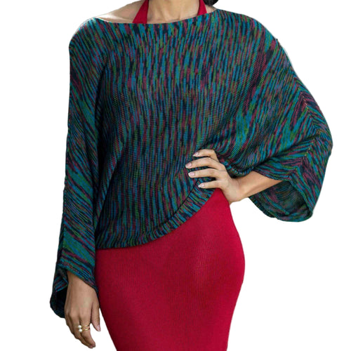 Woman in a patterned top and red skirt.