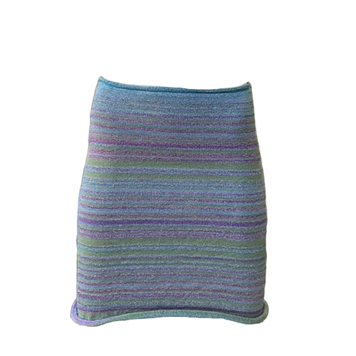 A mannequin displaying a multicolored, metallic knit tube skirt/top with a knit elastic band over the waist.